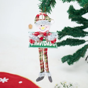 Close-up of a plush Christmas snowman hanging ornament with a Navidad green sign