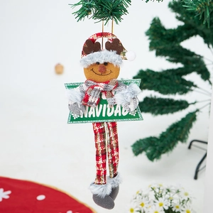 Detail of Christmas plush reindeer ornament with Navidad wooden sign and red plaid hat