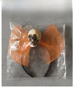 Serre-tête Halloween avec crâne et nœud en résille orange sous emballage