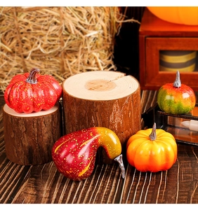 Detailed view of realistic foam pumpkins and gourds set in a rustic autumn harvest setting