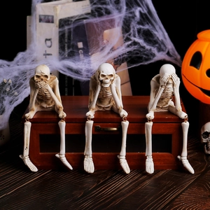 Three Halloween skeleton resin figurines in hear, see, speak no evil poses for spooky decor