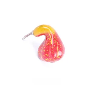 Detail of red foam faux pumpkin with yellow spots for Thanksgiving harvest decoration