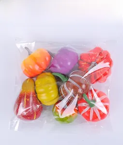 Assorted artificial foam pumpkins and harvest fruits in transparent OPP bag packaging