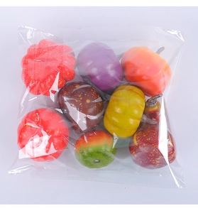 Close-up of assorted mini foam pumpkins in various colors for autumn harvest decoration