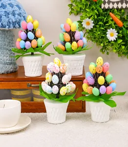 Colorful Easter spotted eggs in white woven pots displayed with green festive decorations