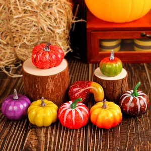 Assorted artificial foam pumpkins in various colors for Thanksgiving harvest table decor