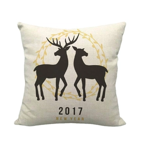 Linen Christmas pillow case with reindeer silhouette and festive golden wreath design