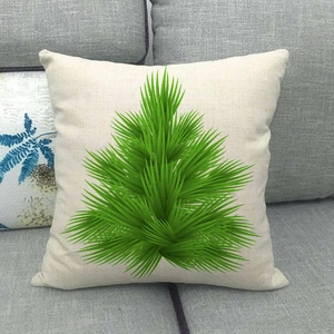 Detailed texture of linen Christmas tree pillow case on a modern grey fabric sofa