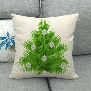Close-up of linen Christmas tree pillow cover showing the natural fabric texture on a sofa