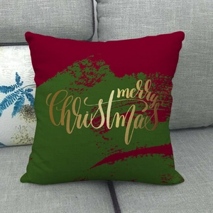 Detailed texture of linen cushion cover with golden Merry Christmas text on festive background