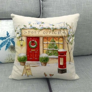 Detail of vintage Christmas post office print on linen throw pillow cover on sofa