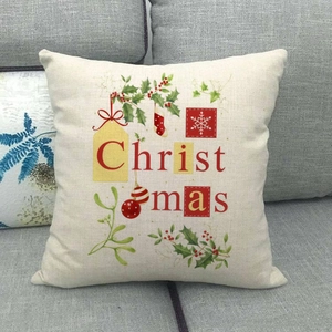 Macro detail of Christmas themed linen pillowcase on sofa with festive holiday pattern