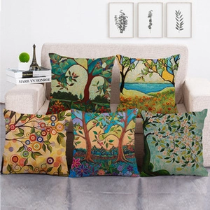 Detailed close-up of five linen pillow covers with artistic colorful tree oil painting designs