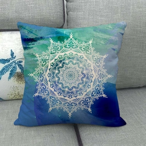 Bohemian linen cushion cover with white mandala print on blue and teal gradient background