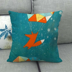 Close-up of linen pillowcase with cartoon fox illustration on gray fabric sofa
