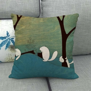 Close-up of whimsical cartoon squirrel and tree pattern on a teal linen throw pillow cover.