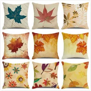 Macro view of nine autumn maple leaf designs on square linen throw pillow covers