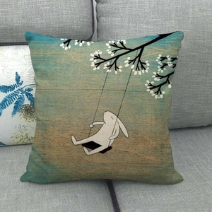 Cartoon rabbit swinging under flower tree on a linen pillowcase in vintage teal gradient