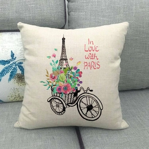 Detail of linen pillow cover featuring Paris Eiffel Tower and floral bicycle art