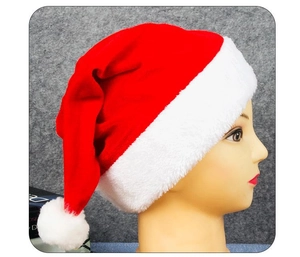 Detail of red velvet Christmas hat with white plush trim worn on a display head
