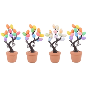 Four colorful Easter egg potted trees decorations with speckled eggs on white background