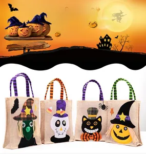 Detail of four burlap Halloween gift bags with witch, skeleton, cat, and pumpkin designs