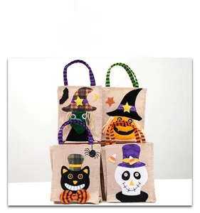 Detail of four Halloween linen gift bags featuring pumpkin, skull, cat, and witch designs