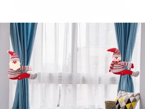 Detail of Santa and Snowman curtain tiebacks with red and grey checkered festive patterns