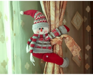 Detailed view of snowman curtain tieback with red knit sweater and striped scarf