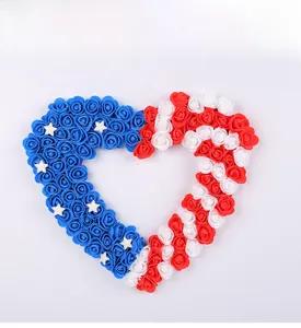 Macro detail of heart-shaped wreath with red, white and blue roses for USA Independence Day