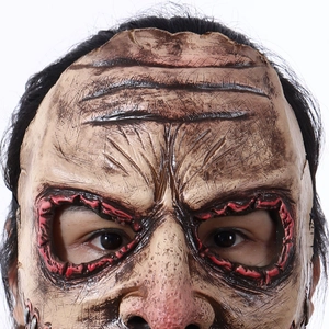 Detailed close-up of realistic horror latex mask with scars, stitches and synthetic hair