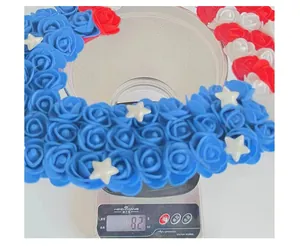 Close-up of lightweight USA Independence Day wreath on digital scale weighing 82g