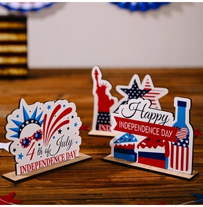 Close-up of 4th of July wooden tiered tray decorations with Statue of Liberty and stars