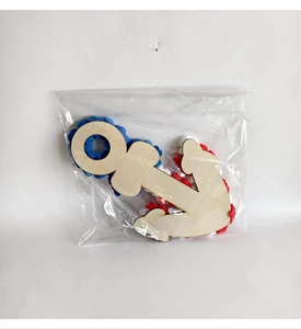 Detail view of 4th of July DIY wreath kit with wooden anchor and red white blue PU roses