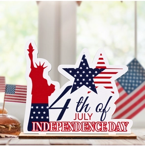 Detail of 4th of July wood table sign with Statue of Liberty and stars stripes design