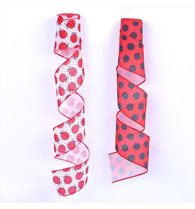 Detailed view of ladybug pattern ribbons and red black polka dot decorative satin fabric