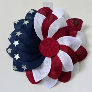 Detail of USA flag themed burlap wreath with stars and blue red white fabric petals