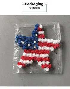 Detail of American flag star wreath with red white and blue roses in clear packaging