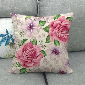 Close-up of floral linen pillowcase showing detailed rose print and fabric texture