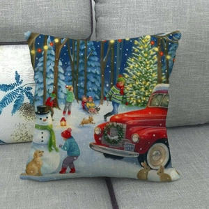 Detailed view of linen Christmas throw pillow with vintage red truck and snowman print