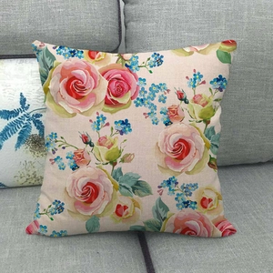 Macro shot of floral linen cushion cover texture with pink and red rose patterns