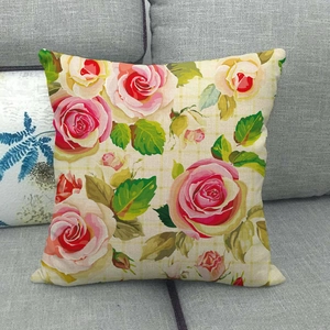 Detail of vintage floral linen pillowcase showing pink roses on a plaid beige background