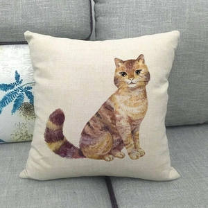 Linen animal throw pillow featuring watercolor ginger cat illustration on a sofa