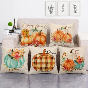 Set of 5 autumn harvest linen pillow covers with pumpkin patterns on a white sofa