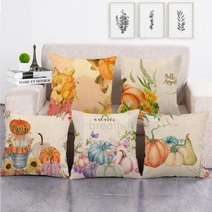 Detail of five linen pillow covers with watercolor autumn pumpkin and floral prints