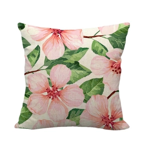Linen cushion cover with realistic pink floral and green leaf print on beige fabric
