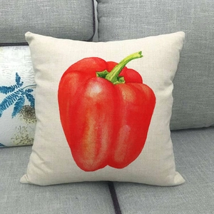 Close-up of linen pillow cover with a vibrant red bell pepper watercolor design
