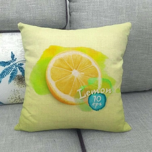 Linen square throw pillow cover featuring watercolor lemon slices on a gray sofa