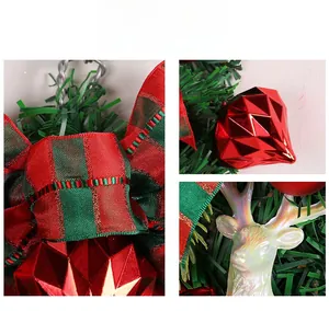 Detail of Christmas wreath with red plaid bow, geometric ball and reindeer ornament