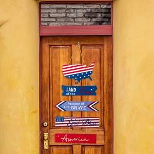 Detail of wooden 4th of July hanging sign with patriotic slogans and US map on a door
